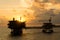 Silhouette of oil production platforms at Terengganu oil field during sunset