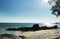 Silhouette of old stranded abandoned shipwreck sitting on the shore of the beach.