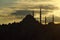 Silhouette of the old town - Sultanahmet mosques in setting sun in Istanbul Turkey.