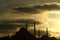 Silhouette of the old town - Sultanahmet mosques in setting sun in Istanbul Turkey.