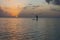 Silhouette in of paddle boarder in the Pacific Ocean