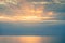 Silhouette of paddle boarding man at sunset