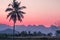 Silhouette Palm  Coconut tree with Mountains on background  horizon hills in Kanchanaburi Thailand at sunet