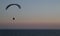 Silhouette of a para-glider in last daylight