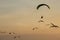 Silhouette Paramotor, Parachute, Paraglide flying in the sunset