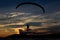Silhouette paramotor / paraglider flying on the sky with seavie