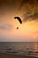 Silhouette paramotor in sunset with Sea View