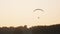 Silhouette of the Paramotor Tandem Gliding And Flying In The Air. Copy space