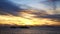 Silhouette of passenger boat moored at sea with dramatic sunset sky