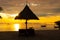 Silhouette of pavillion on the beach beautiful color landscape sky twilight in nature backgroun