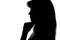 Silhouette of a pensive woman