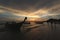 Silhouette of a people and boat by the beach