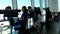 Silhouette of people close up looks through window at airport