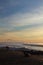 Silhouette of people colorful sunset on atlantic coast with breaking waves with mountain la rhune, capbreton, france