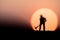 Silhouette people mining on sky sunset background.