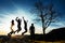 Silhouette of people. People in jump. Friends have fun at sunset. Funny friends. Best friends. Friends traveling. Group of people