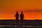 Silhouette of people to see the sea and sunset along the coastline at Hin Kong Beach Phangan Island, Thailand.