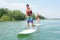 Silhouette perfect couple engage standup paddle boarding