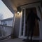 Silhouette of a Person Entering a Home at Dusk. Generative ai