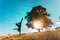 Silhouette of person at the foot of the tree