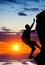 Silhouette of a person without insurance climbs the rock