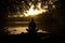 silhouette of a person meditating in nature serenity associated with yoga meditation Generative AI