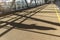 silhouette of a person with a phone in elevated passage corridor bridge