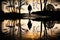 silhouette of person, with puddle reflection, walking in park