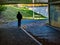 Silhouette of person in subway underpass