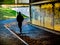 Silhouette of person in subway underpass