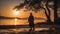 silhouette of a person walking on the beach at sunset a man in a black robe stands on the shore of a lake at sunset