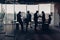 Silhouette photo of businesspeople during working day in modern meeting room