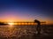 Silhouette of a photographer on beautiful sunset or sunrise at p