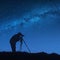 Silhouette of photographer at night