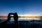 Silhouette of Photographer take photo with mirorless camera.People side view,Young traveler sightseeing with beautiful sunset