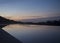 Silhouette of Phuket city during sunrise view from infinity pool