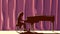 Silhouette pianist in concert hall in spotlight.