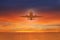 Silhouette of plane in the sky above Sea at Sunset. travel, flight, vacation Concept. Low key photo. relax time