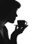 Silhouette portrait of a female with a cup of hot drink on a saucer