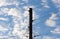 Silhouette power pole against the sky