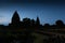 Silhouette of Prambanan temple near Yogyakarta in Indonesia at nighttime