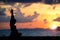 Silhouette pregnancy yoga on beach