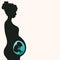 Silhouette of a pregnant woman with developing fetus