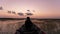 Silhouette Professional man controls drone in the boat Beautiful sky sunset or sunrise time