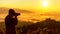 Silhouette professional man photographer holding camera for take a photo the mountain