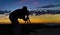 Silhouette of a Professional Photographer at sunrise