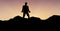 Silhouette professional standing on mountain against sky