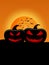 Silhouette pumpkins with full moon in halloween night