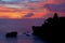 Silhouette of Pura Tanah Lot at coloured sunset.