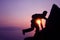 Silhouette purple of man climbing rock, Photographer on the mountain at sunrise